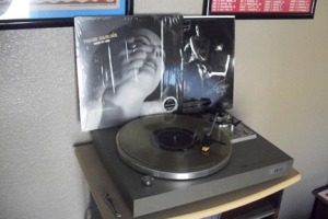 My brand new copy of Screws Get Loose by Those Darlins on translucent gold vinyl on the turntable.